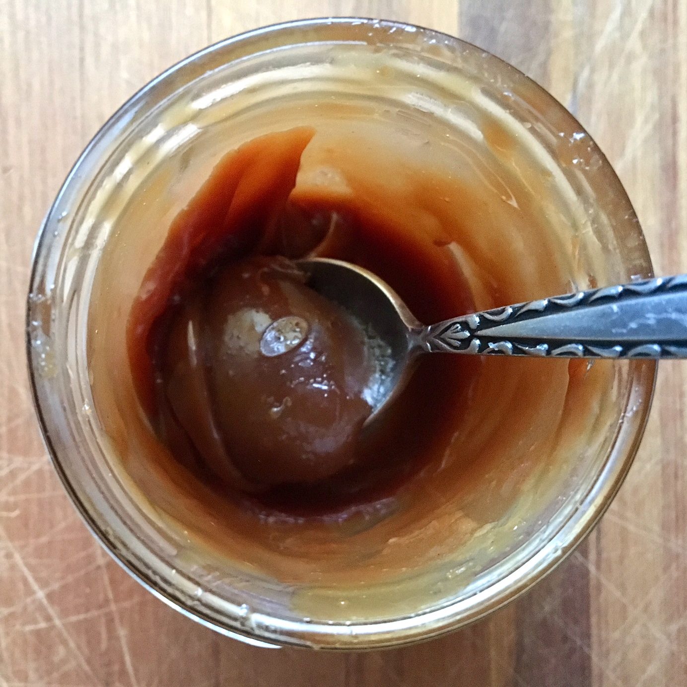 Homemade goats’ curd draining in a muslin-lined sieve over a bowl