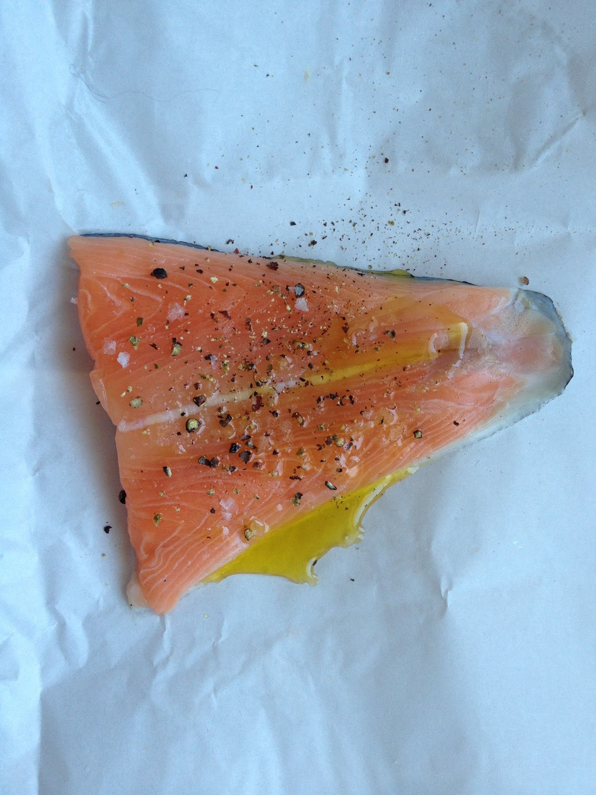 Salmon fillets cooking in a sealed plastic bag submerged in hot water